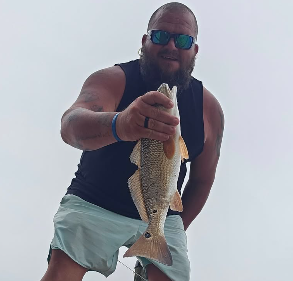 Man holding up fish