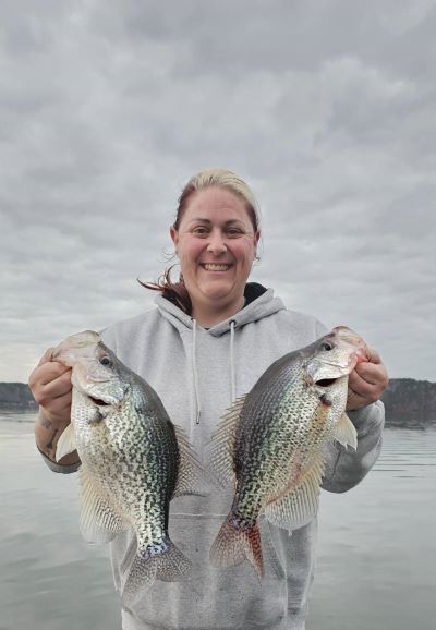 Fisher-woman with two large fish